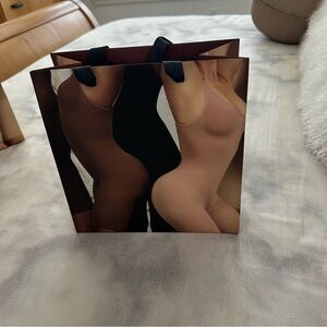 Skims Small and Stylish Shopping Bag with Artistic Design